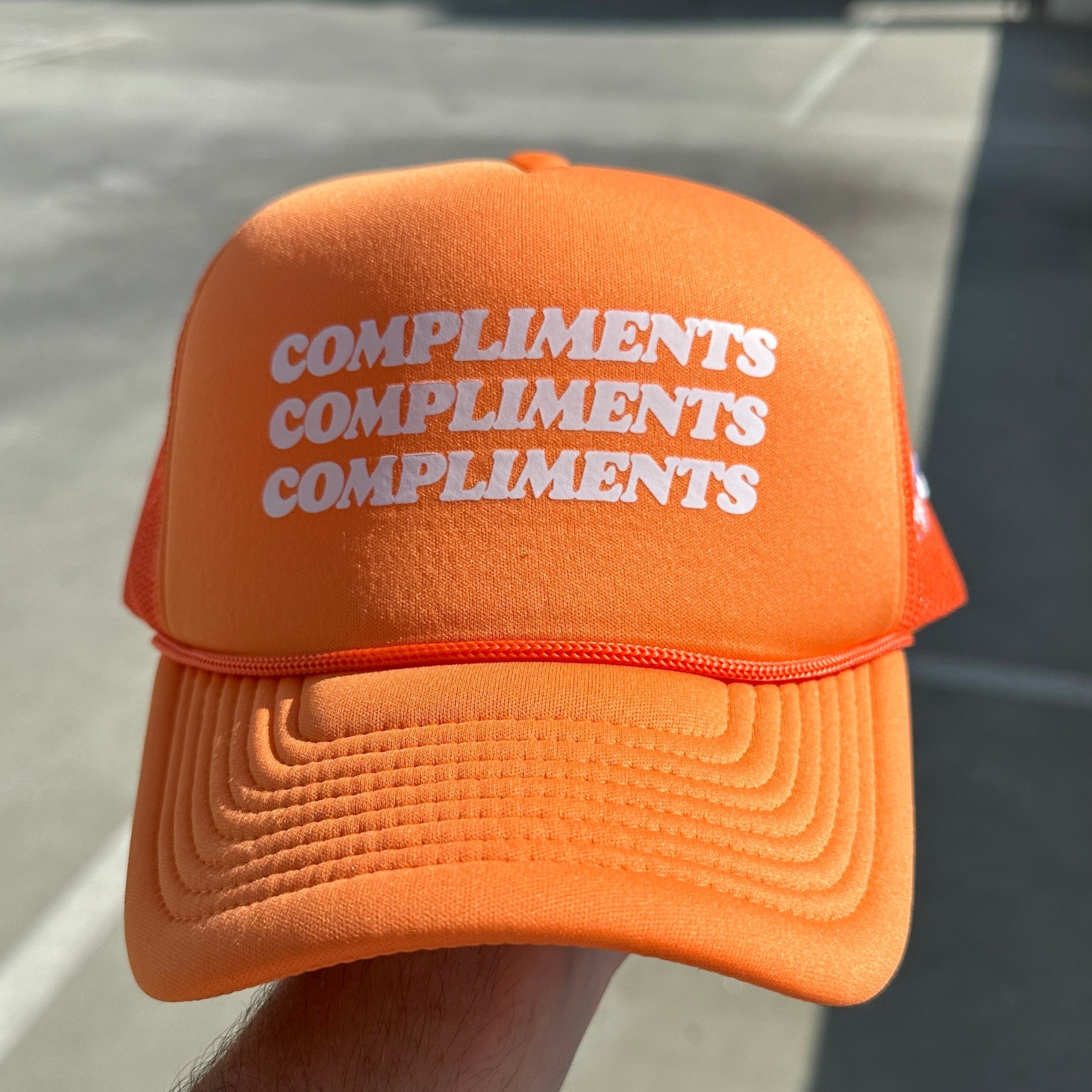 Compliments Orange 🦞 Trucker