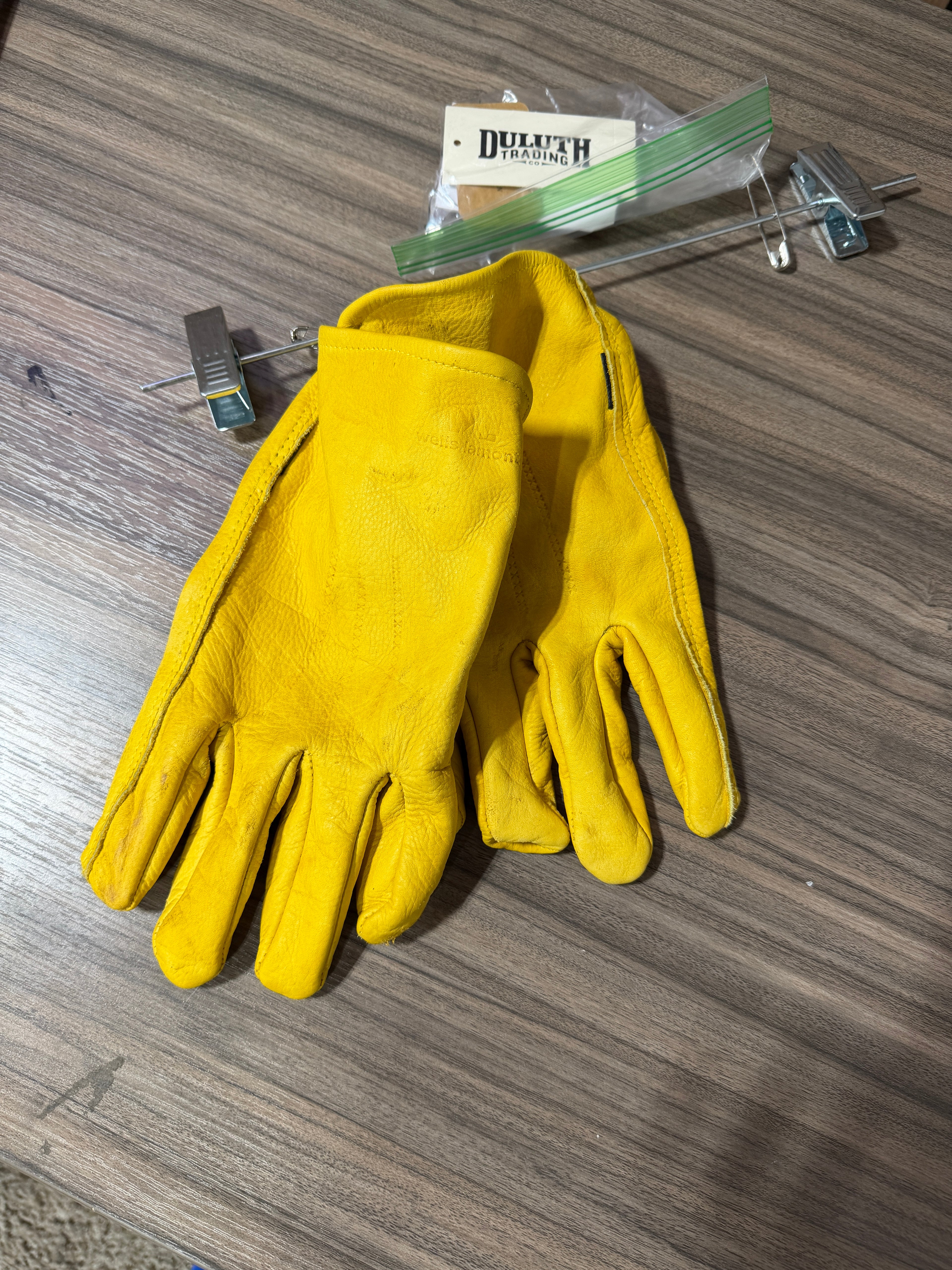 Duluth Trading Co. leather work gloves in mustard yellow