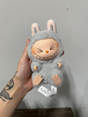 POP MART THE MONSTERS Have a Seat Series Vinyl Plush Pendant – HEHE (Grey Variant)