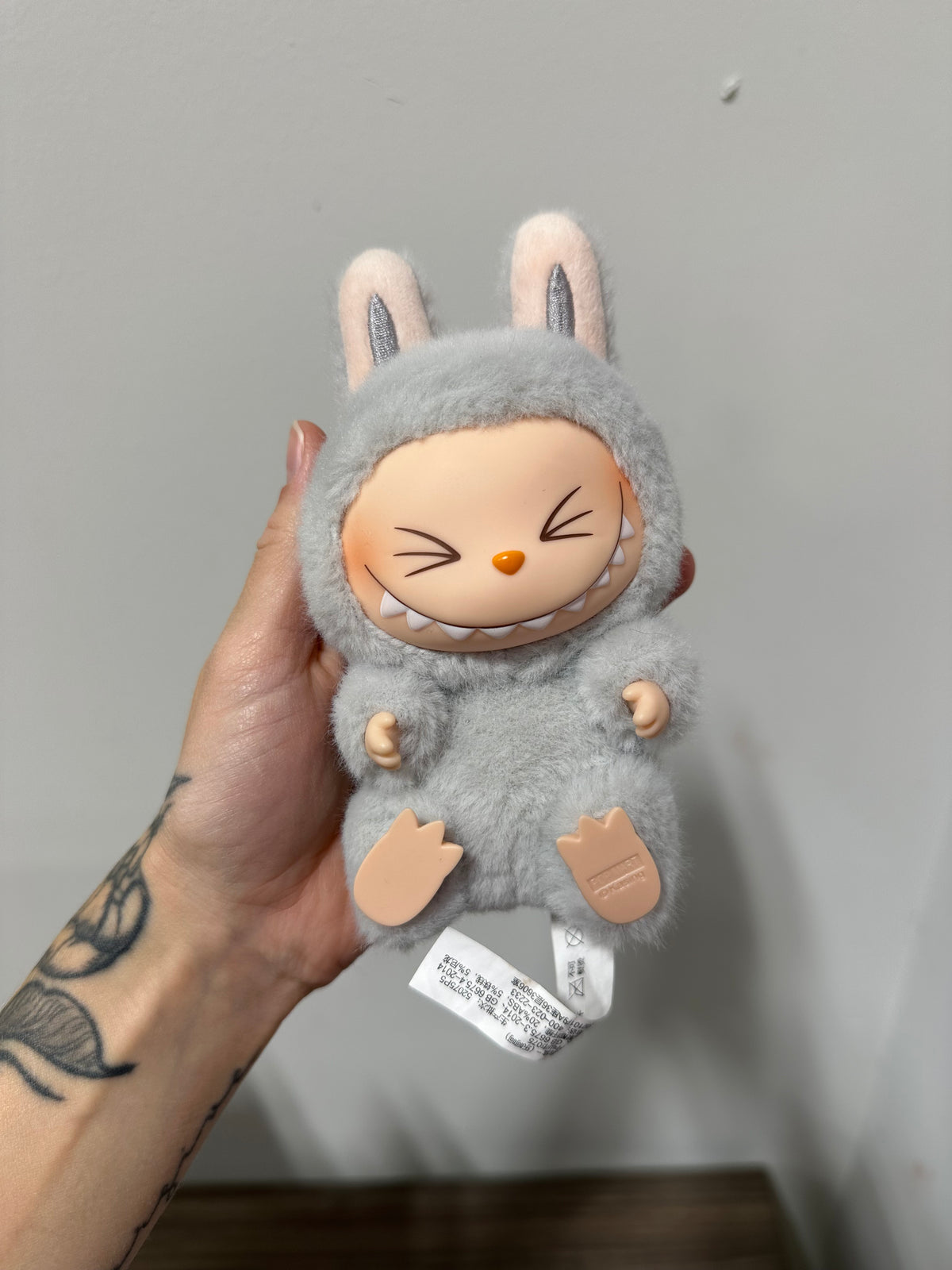 POP MART THE MONSTERS Have a Seat Series Vinyl Plush Pendant – HEHE (Grey Variant)